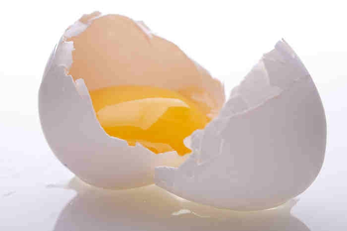 image of a cracked egg with yolk