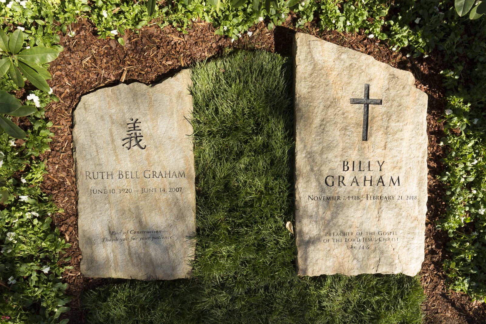 : A slab of North Carolina stone marks the grave of Billy Graham, buried next to his wife, Ruth, at the Prayer Garden located next to the Billy Graham Library in Charlotte. The marker inscription bears the text, "Preacher of the Gospel of the Lord Jesus Christ" with the Scripture reference, John 14:6. (Billy Graham's Grave Marker)