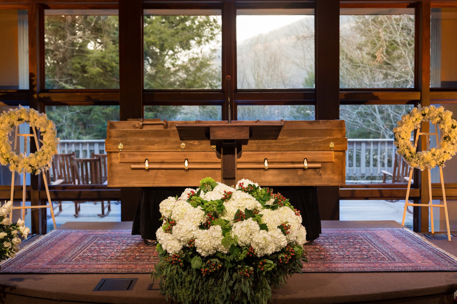 The body of Billy Graham—in a simple casket made of pine—rests behind a pulpit at The Billy Graham Training Center at The Cove in Asheville, N.C. The family felt the casket’s placement was fitting since Graham spent most of his life preaching the gospel from behind a pulpit.