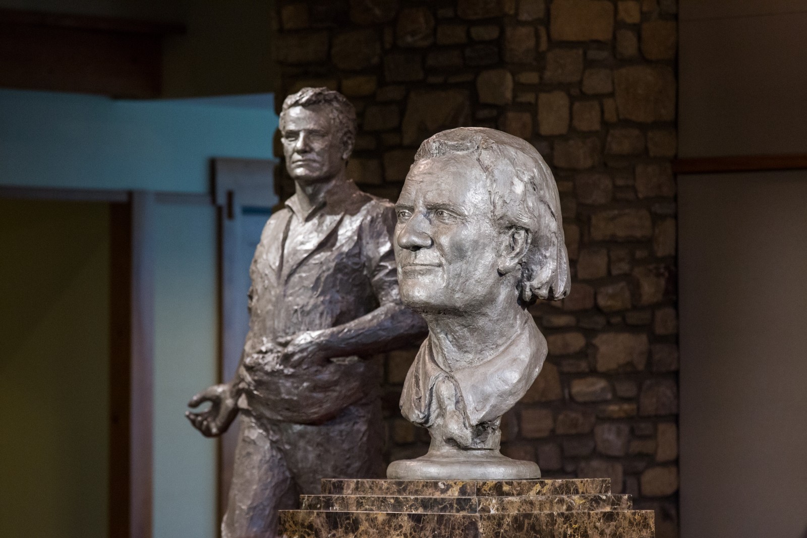 "Billy Graham as Messenger" (in the foreground) and "Billy Graham as Sower" (in background) are displayed following the unveiling ceremony with Chinese artist Yuan Xikun and Billy Graham's son Franklin Graham.