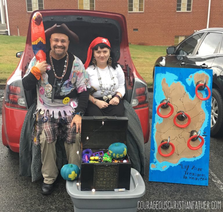 Cap'n ChristianBlogR and SimplySpokn at Trunk or Treat 2018 along with the Pirate Chest and Pirate Ring Toss Game.