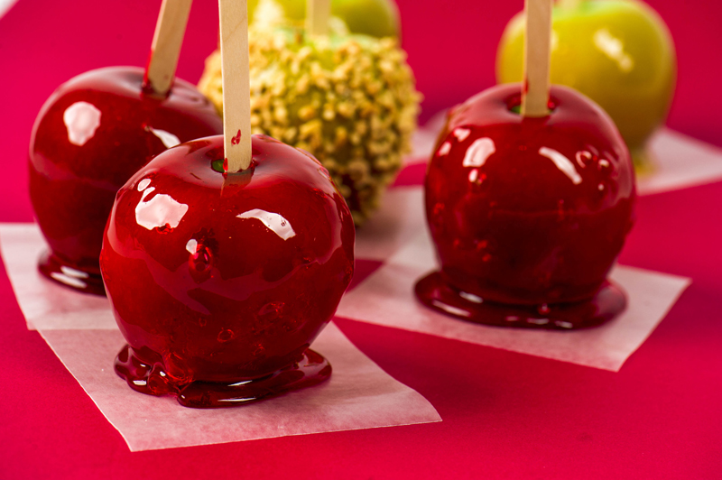 · Candy Apples: These are apples on a stick and coated with yumminess. There are red ones with a red glaze. Others are made with a caramel glaze. Sometimes nuts are added to those. Growing up, we had an neighbor, her church made the red candy apples for the fair and would bring my sister and I each one, each year. 