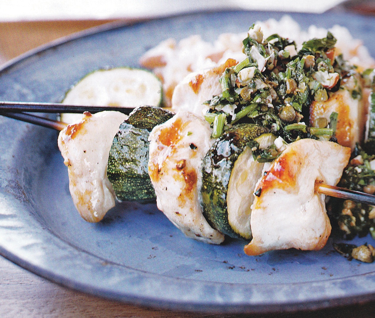 Skewered chicken goes great on the grill - Grilling chicken is an easy way to transform this versatile food into something even more delicious. Various cultures serve chicken in kebab form after grilling it over an open flame, and taste is a big reason this particular method of cooking chicken is so beloved. Recipe for Spiedini of Chicken and Zucchini with Almond Salsa Verde.