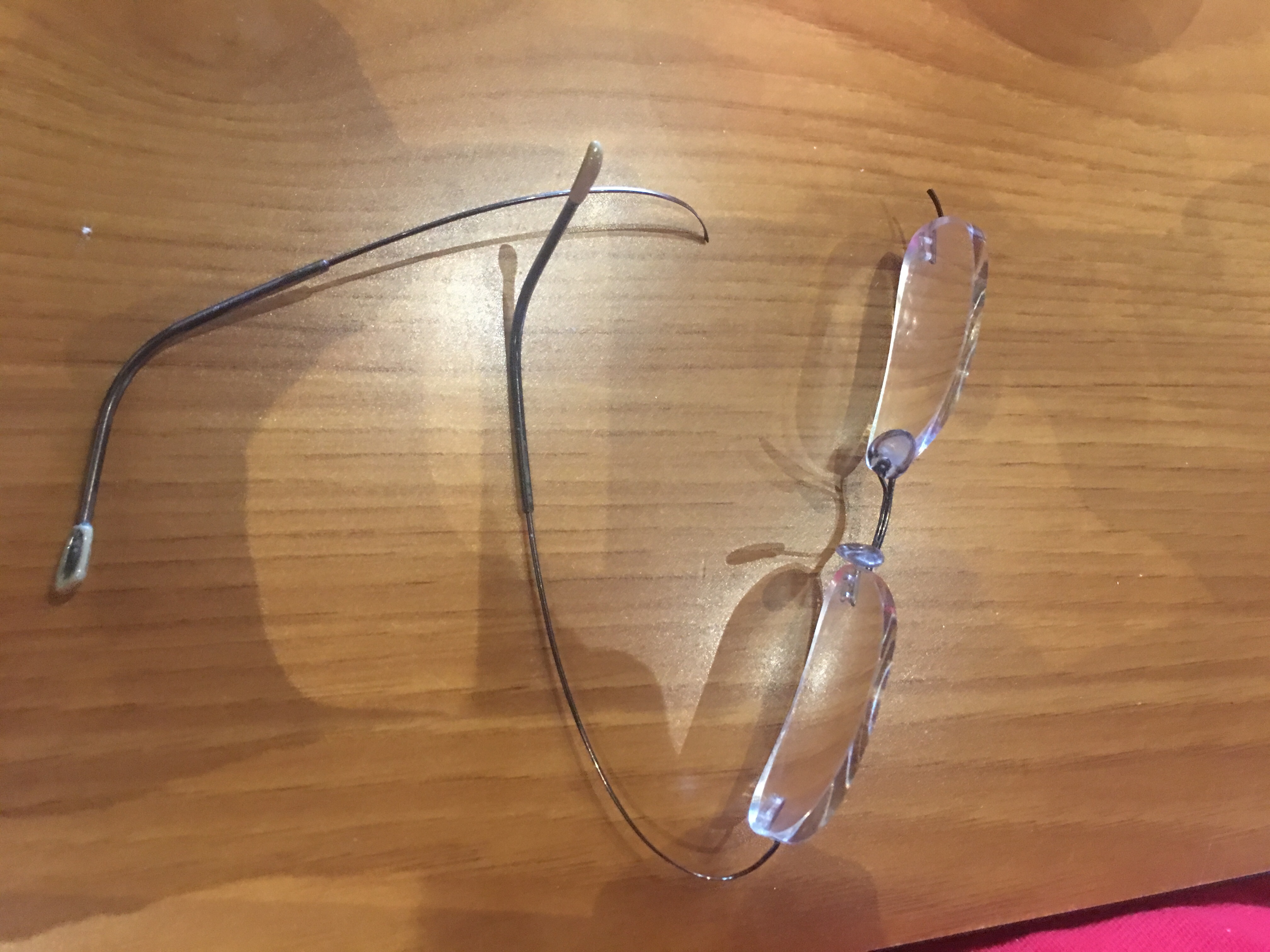 My "guaranteed unbreakable" eye glasses that broke. 