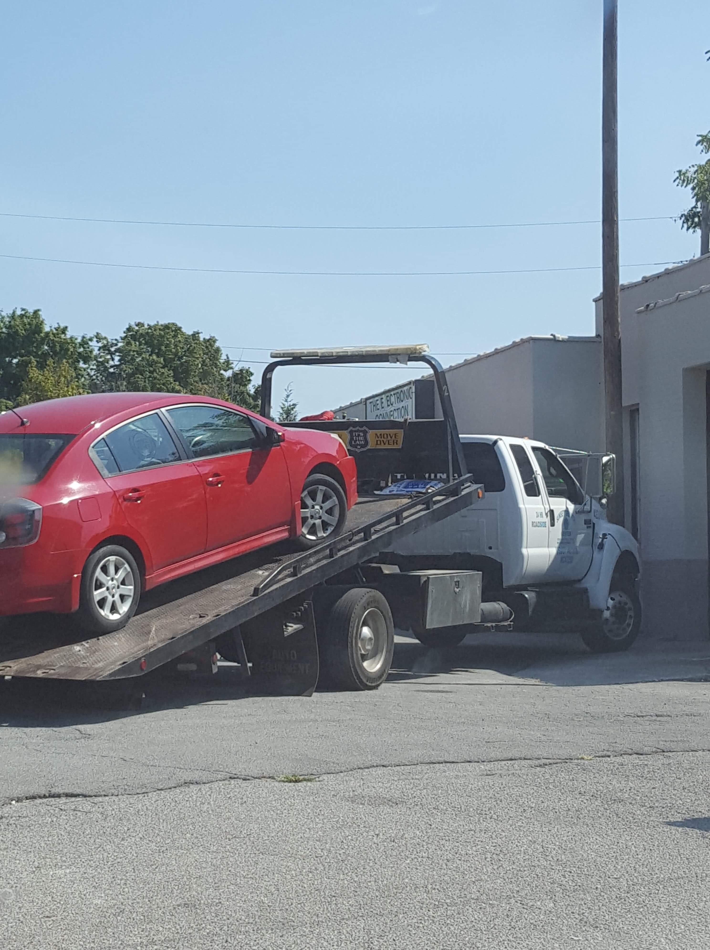 Lil Red on a Tow Truck (Sunset Towing) Lower Ball Joint & Axle - This is something I’d recommend you get checked on your car with high mileage. I had my driver side ball joint broke off and it also broke the driver side axle. I took it to get repaired and the other side lower ball joint was bad too.  Photo Credit: Heather Patterson