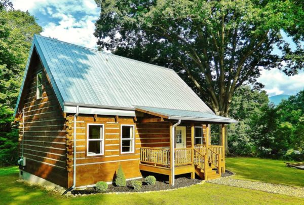 My Dream Home would be a tiny log cabin home. Maybe something similar or on the lines of this log cabin home from Log Cabins for Less.