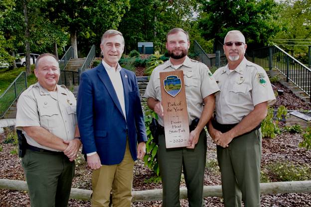 Frozen Head State Park Named State Park of the Year - The Tennessee State Parks Park of the Year Award is presented to Frozen Head State Park. From left are Mike Robertson, director of park operations; Jim Bryson, deputy commissioner of TDEC; Jacob Ingram, park manager; and Kim Moore, area manager.