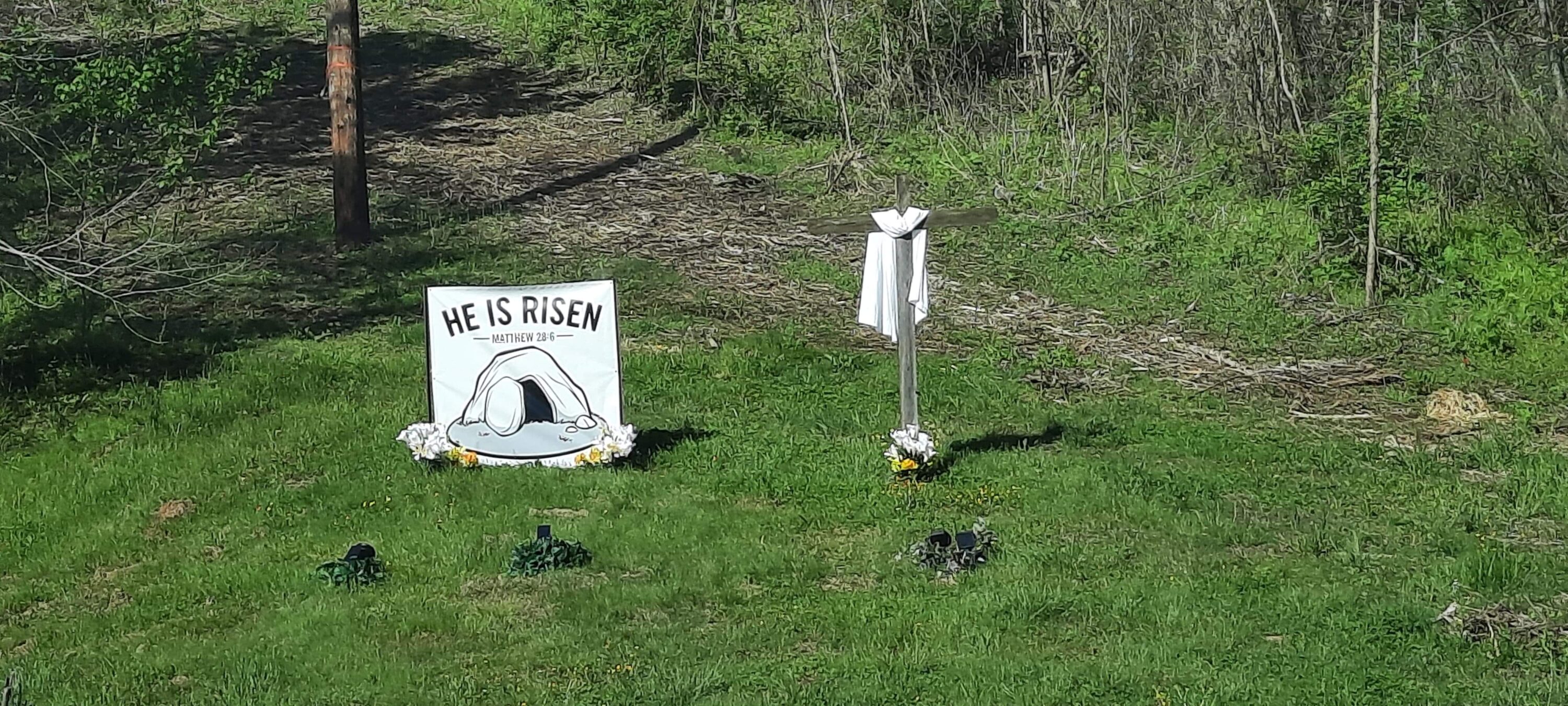 He is Risen Display with a banner saying He is Risen Matthew 28:6 and a Cross beside it in Mascot off 11-W.