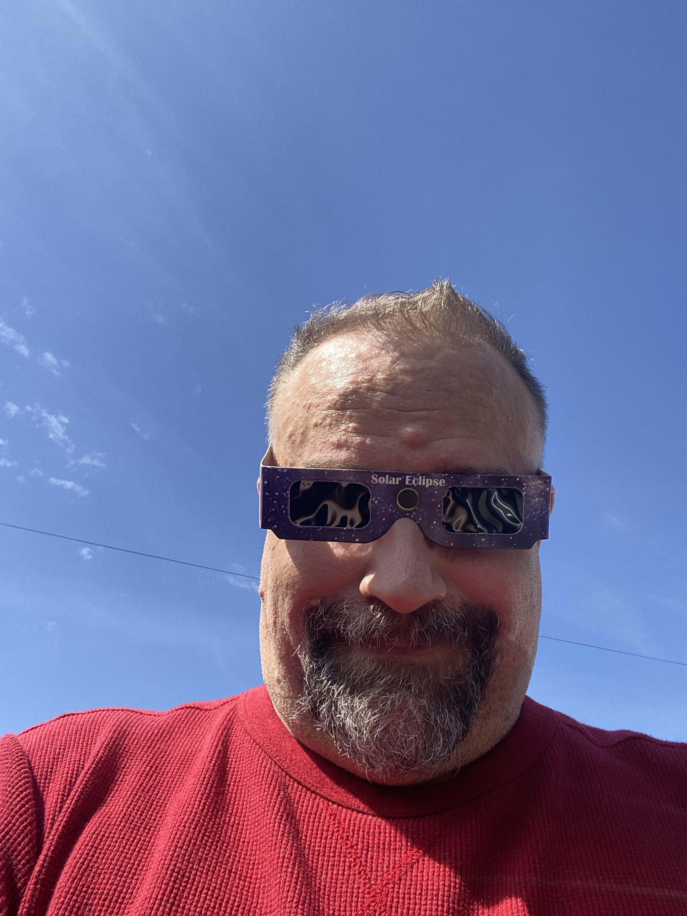 Steve wearing a general pair of solar eclipse glasses.