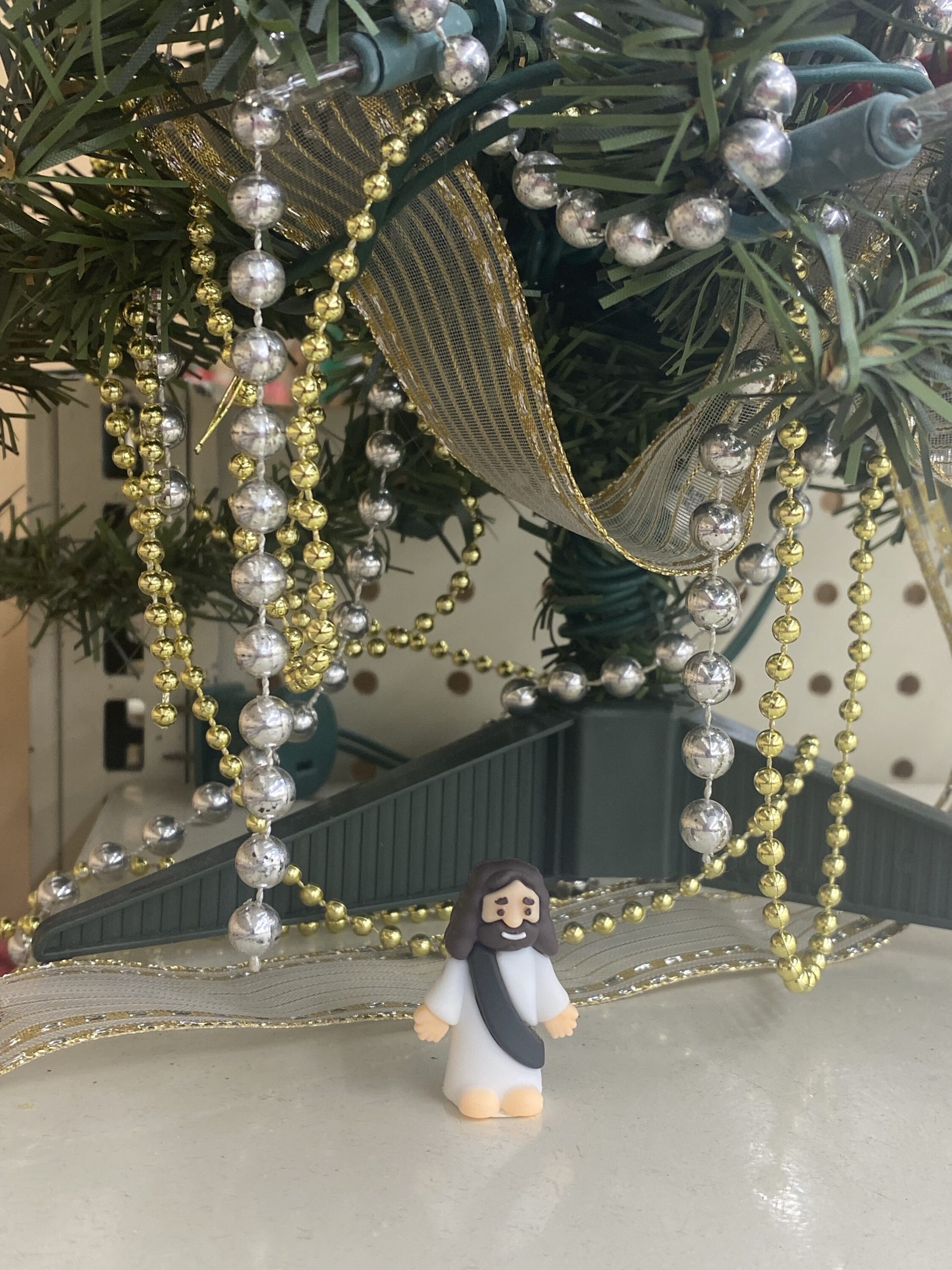 Place Little Jesus with Christmas decorations. Jesus is the greatest gift ever given. 