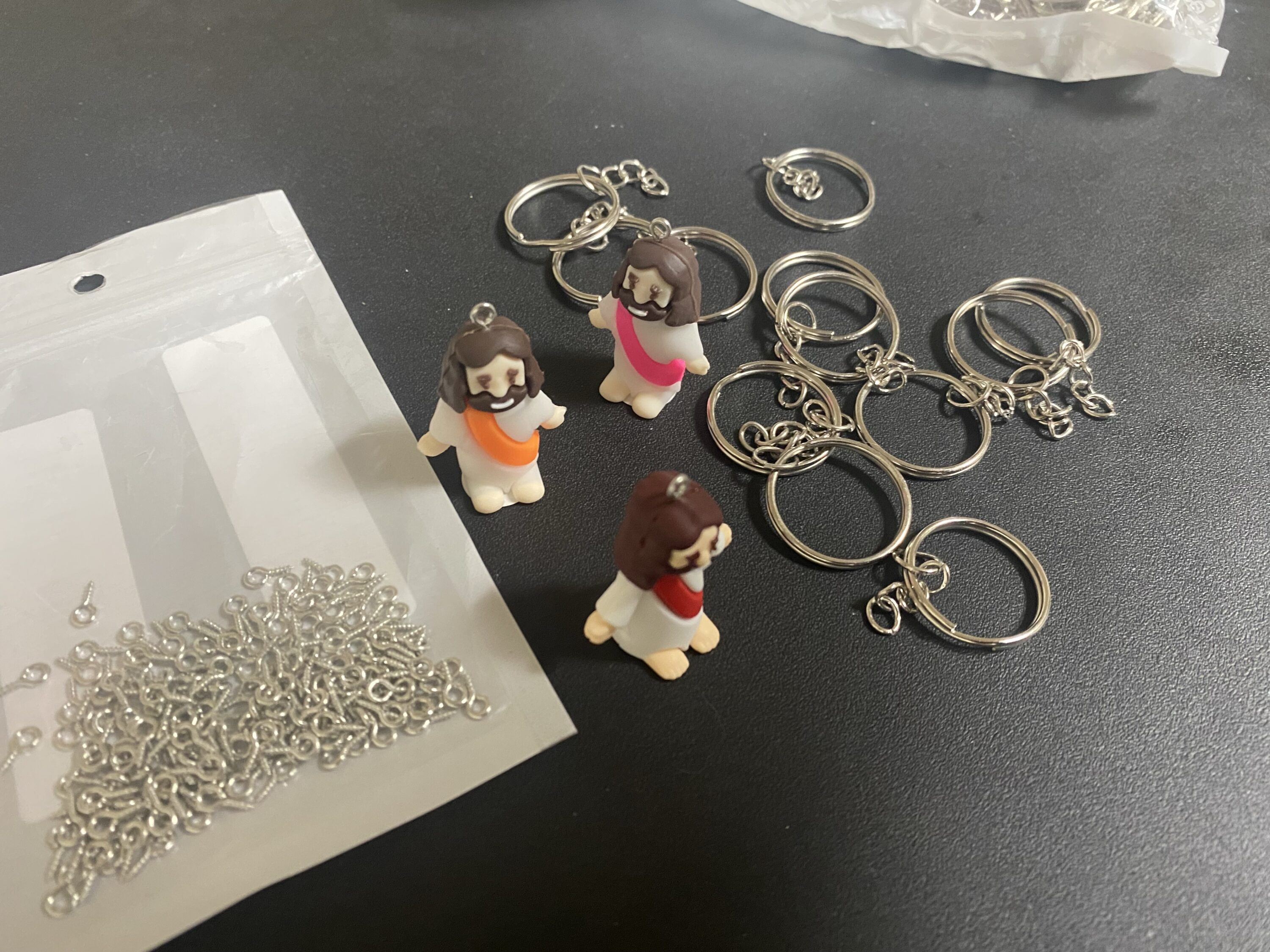 Turning the little Jesus figurines into a keychain to hand out to people it’s very simple and only needs a few items.