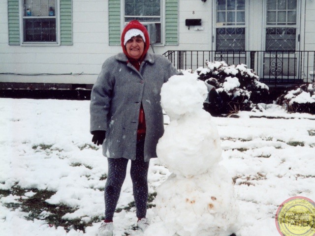 February 26, 2024, we lived next door to my mom. We got a good amount of snow, so she came outside and we built snow people. ​My mom (Paula Elaine Klaus Patterson) making a snowman in 2004. ​