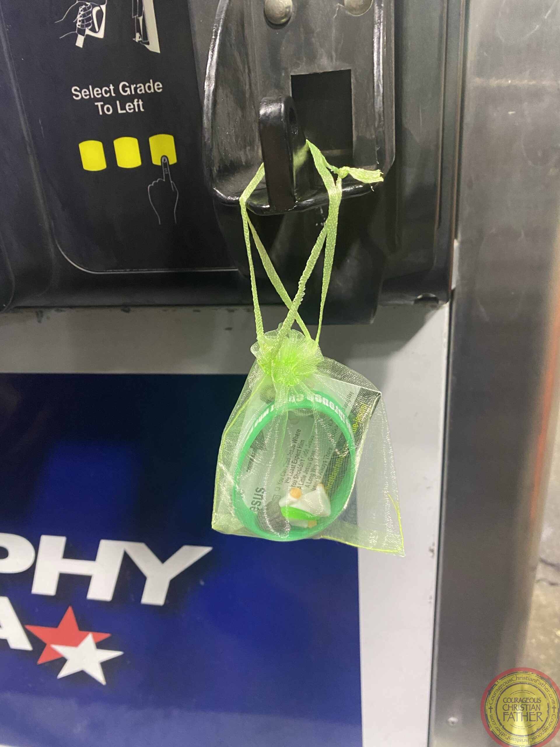 Here is a little Jesus bag hanging on the gas pump.​